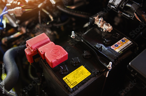 closeup new battery car in engine room - mechanic car battery