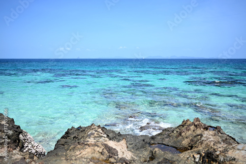 Phuket's clear blue sea water, summer