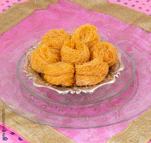 Indian Traditional Sweet Food Desi Ghee Ki Pheni Also Know as Sutarfeni, Firni, Seviyan, Laccha, Feni or Fini maid from maida, Sugar and Flavour photo