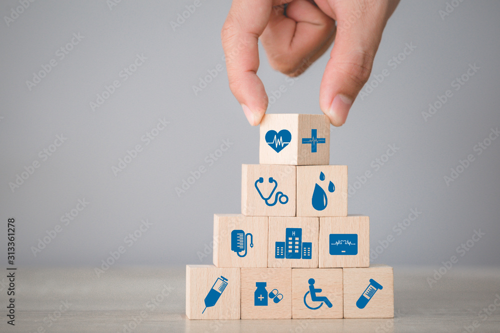 Health Insurance Concept,hand arranging wood block stacking with icon healthcare medical. - obrazy, fototapety, plakaty 