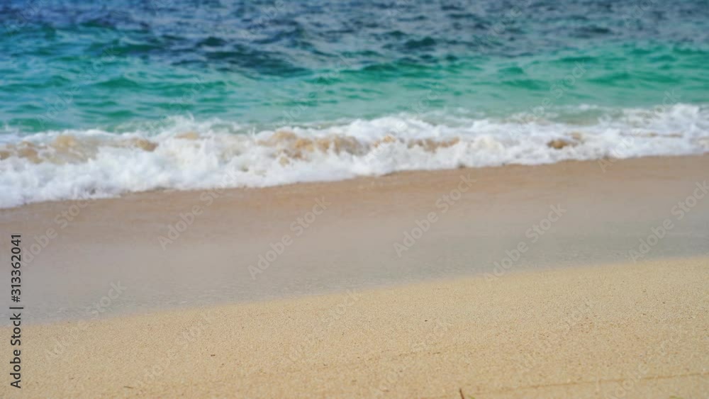 reverse time on the beach with clear blue water. reverse of the crash of the sea wave. surf on a tropical beach with golden sand on the ocean reverse time on the beach with clear blue water. reverse of the crash of the sea wave. surf on a tropical beach with golden sand on the ocean