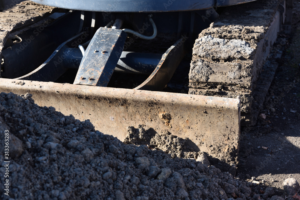 A Bulldozer working for road construction