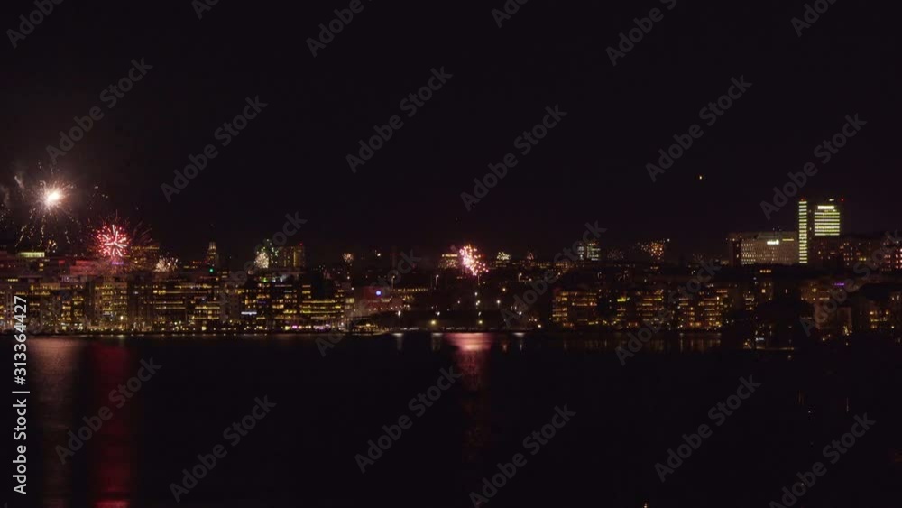 Firework show over city skyline Firework show over city skyline