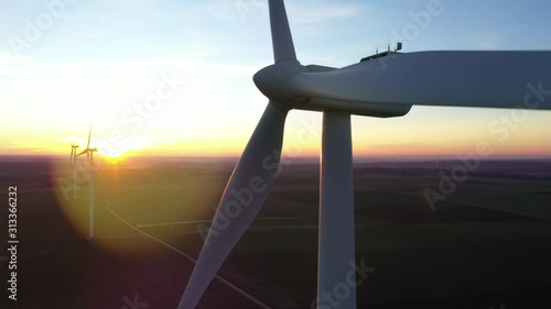 Aerial view of wind turbine at sunset