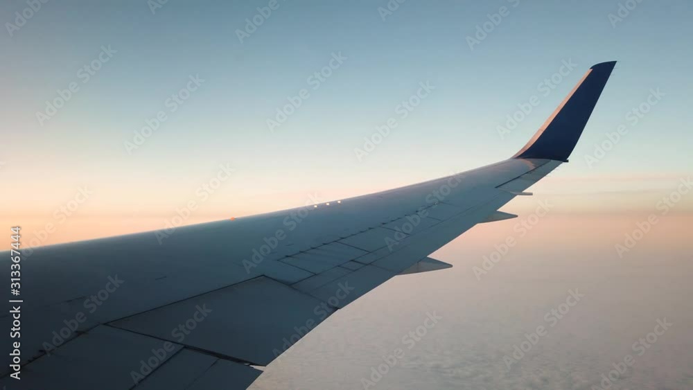Outside airplane view during sunset slow motion Outside airplane view during sunset slow motion