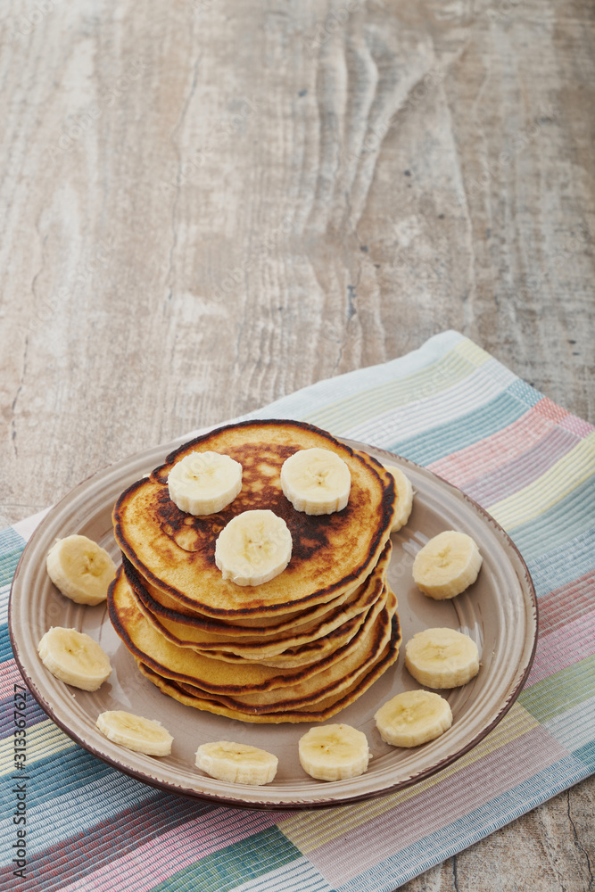 Pancakes with bananas almond and caramel sauce. selective focus. Pancakes with bananas almond and caramel sauce. selective focus.