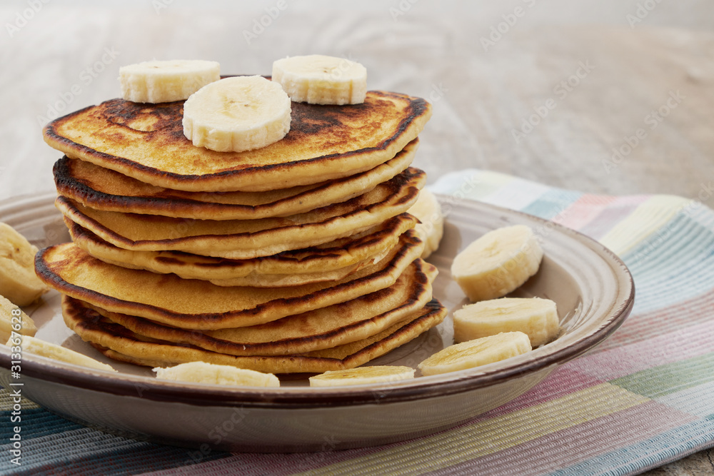 Pancakes with bananas almond and caramel sauce. selective focus. Pancakes with bananas almond and caramel sauce. selective focus.