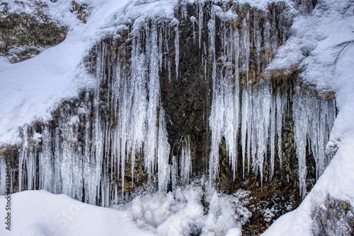 Large stalactites with ice in the mountains on a rock , slovakia mala fatraLarge stalactites with ice in the mountains on a rock , slovakia mala fatra
