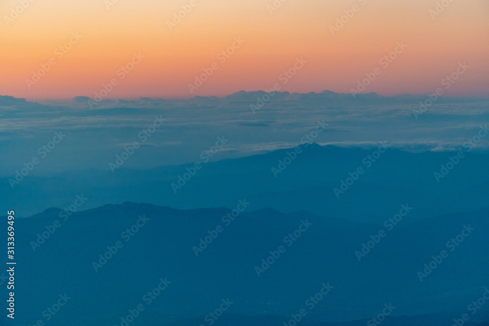 aerial of cloud and mountain in the evening
