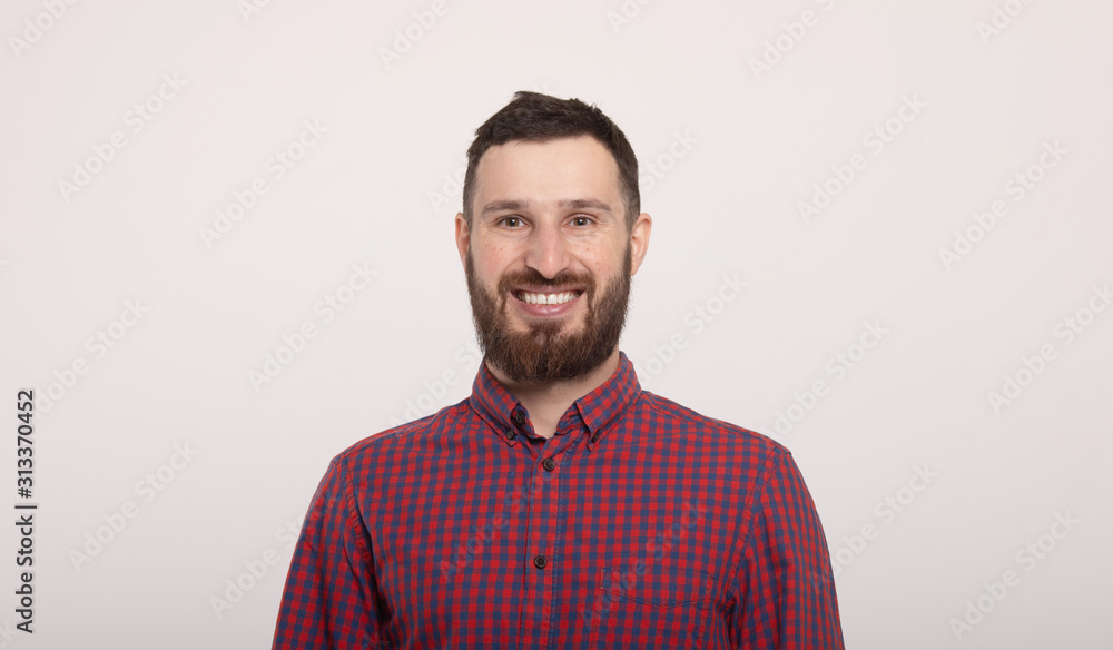 Fototapeta premium Portrait of cheerful smiling bearded man.