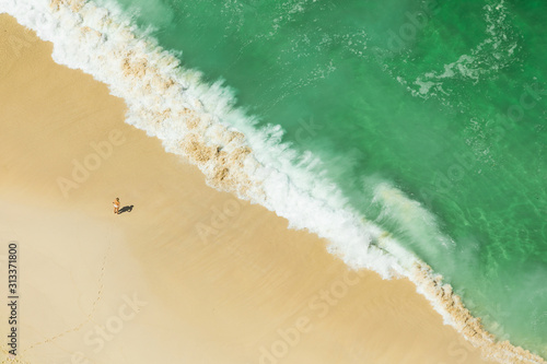 BALI, INDONESIA - DECEMBER 19, 2019: Woman on the remote  Kelinking Beach photo