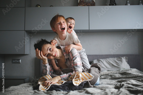 tired mother with two children,Authentic lifestyle
