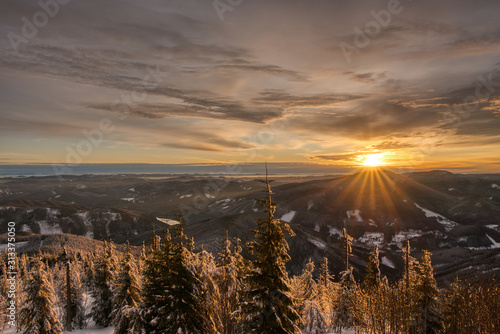Mountain winter landscape with sunset, czech lysa hora