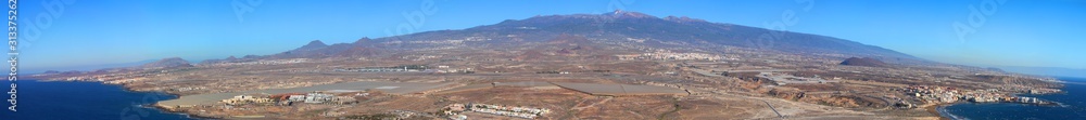 Aerial view at Tenerife island from the south with the volcano Teide and the airport  (Spain)