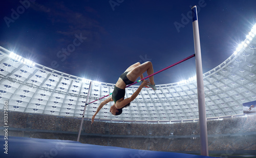 Athlete woman doing a high jump on sport championship.