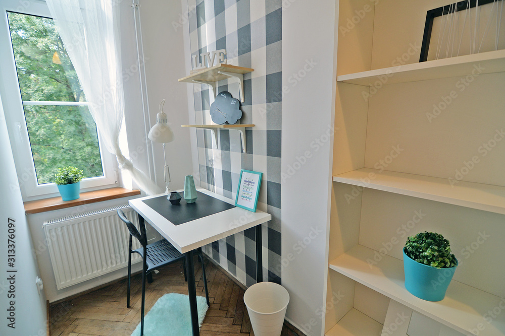 A teenager's room with a study desk.
