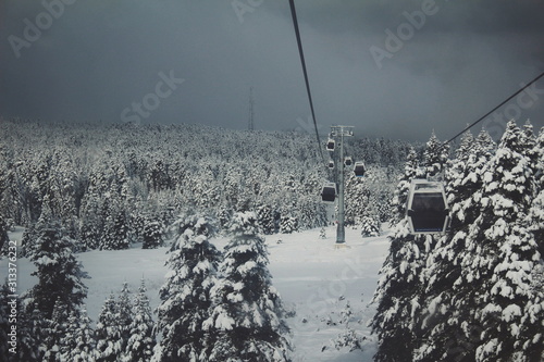 Cable car view in the snowy forest of mountain Uludag photo