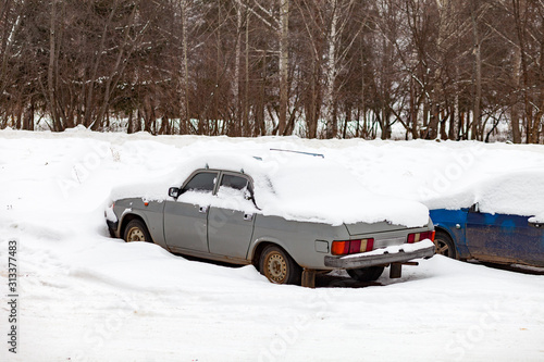 Car under the snow. Russia.
