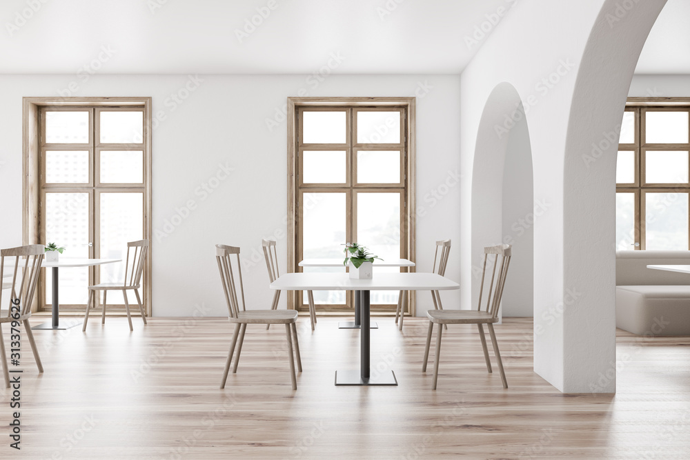 Modern white cafe interior with sofa Modern white cafe interior with sofa