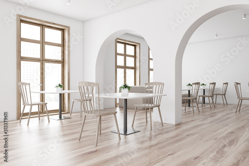 White restaurant corner with arches and sofa © ImageFlow