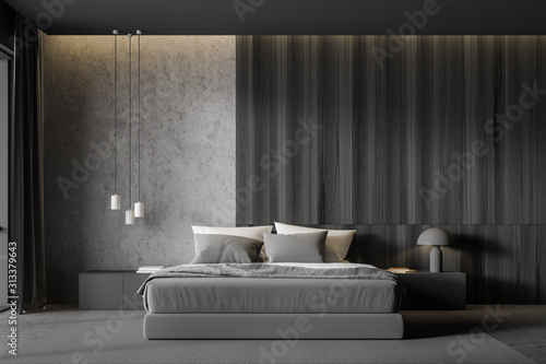 Concrete and dark wooden master bedroom interior photo