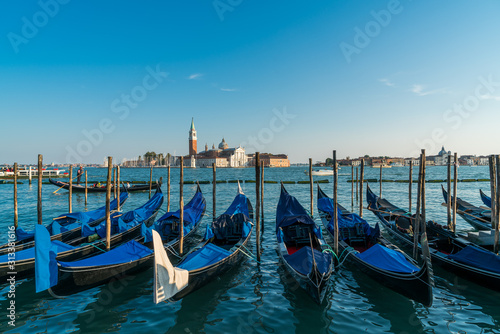 Venice gondolas with the view of San Giorgio Maggiore church from San Marco square in Venice, Italy.