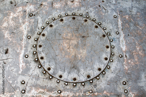 Patch round shape of the welded metal rivets on old metal surface barges
