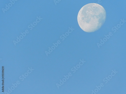 Moon with a blue sky morning view