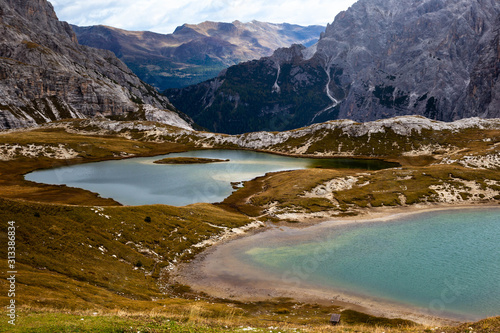 Fototapeta Naklejka Na Ścianę i Meble -  Colorful turquoise lakes in the The Cime di Lavaredo National Park, also known as Drei Zinnen or Three Peaks of Lavaredo. The lakes are surrounded by the mountains. South Tyrol, Italy. 