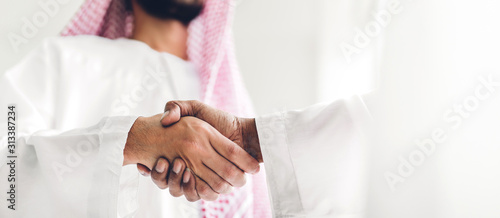 Valokuva Successful of arab business partner handshake together in modern office