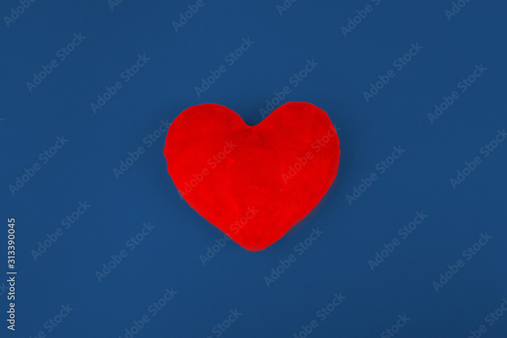 Red heart on color background. minimal concept.