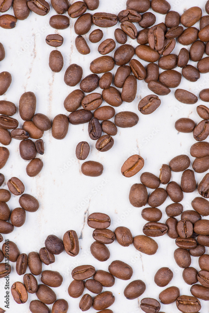 Coffee beans on a white textured background, empty copy space Coffee beans on a white textured background, empty copy space