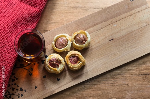 .tea, bagel, hot dog puff pastry concept