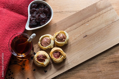 .tea, bagel, hot dog puff pastry concept