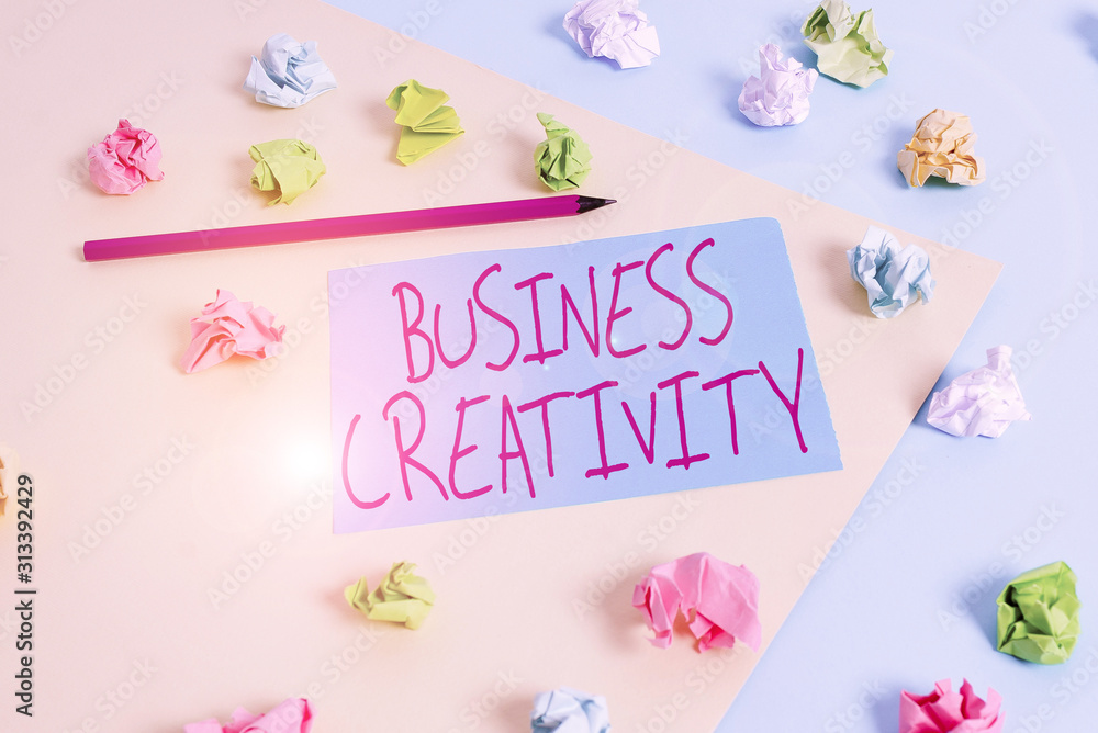 Naklejka premium Writing note showing Business Creativity. Business concept for act of turning new and imaginative ideas into reality Colored crumpled papers empty reminder blue yellow clothespin