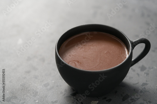 simple cup of hot cocoa drink on terrazzo background