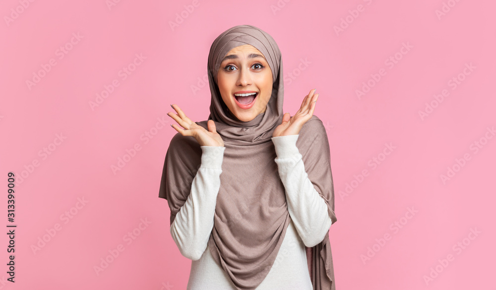 Surprised muslim girl in hijab opened mouth in amazement Surprised muslim girl in hijab opened mouth in amazement