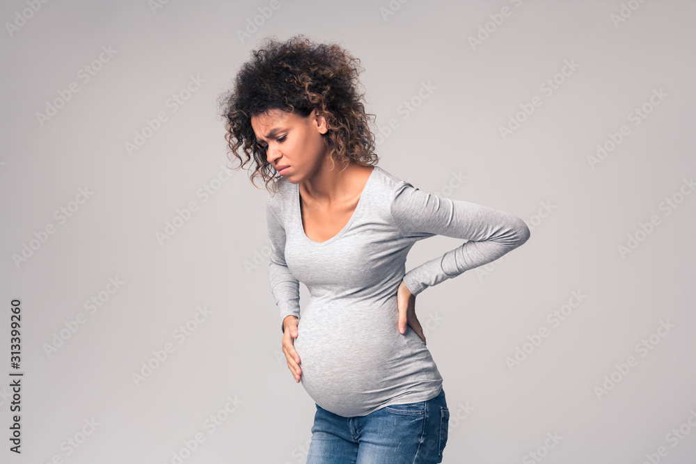 Pregnant woman suffering from abdominal and back pain - obrazy, fototapety, plakaty 
