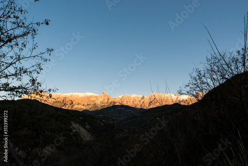 Tzoumerka mountain on a beautiful winter day just a little before sunset photo