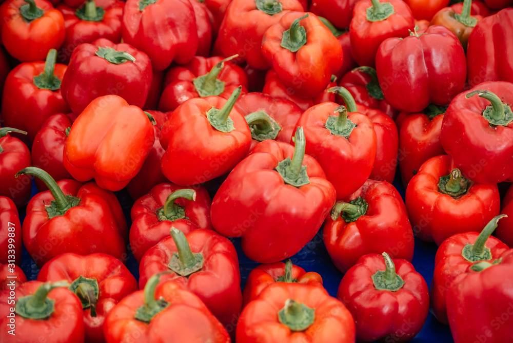 Beautiful selected organic red pepper background, ripe red pepper for preparing meal, lots of red pepper on a market counter. Beautiful selected organic red pepper background, ripe red pepper for preparing meal, lots of red pepper on a market counter.