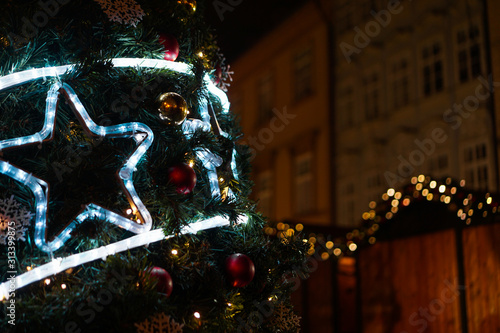 Christmas luminous neon star on the Christmas tree