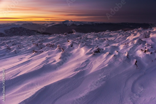 Mountain winter landscape in the Ukrainian Carpathians on the background of the sunset. 