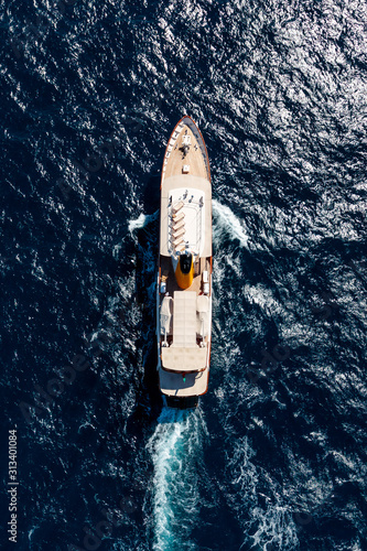 Aerial shot of a boat sailing on the sea - great for background or a blog