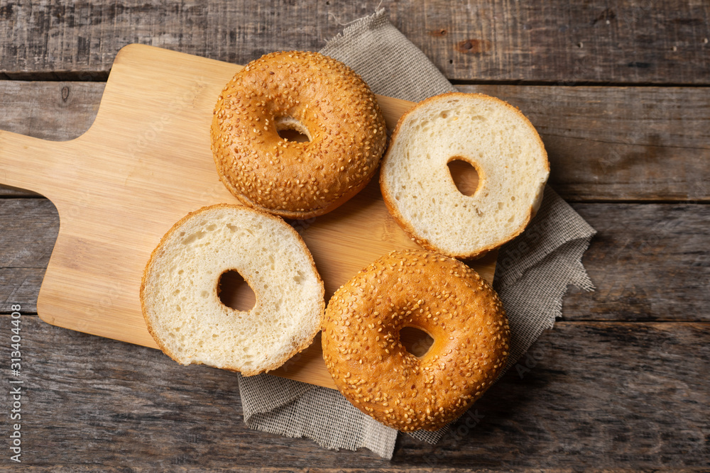 Sesame bagels on wooden background Sesame bagels on wooden background