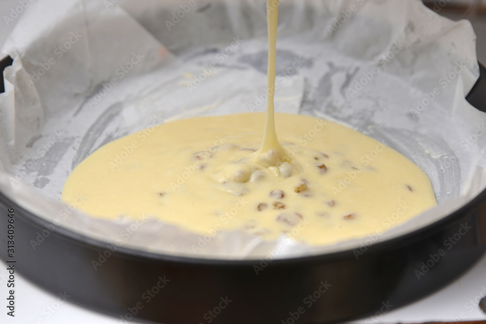 Pie batter is poured into baking dishes. Pie batter is poured into baking dishes.