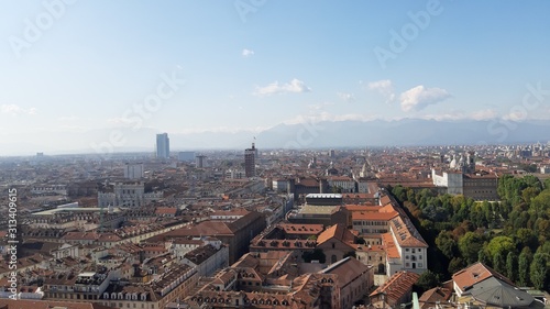 Turin, Italy - 01/004/2019: Beautiful panoramic view from Mole Antoneliana to the city of Turin in winter days with clear blue sky and the alps in the background. 