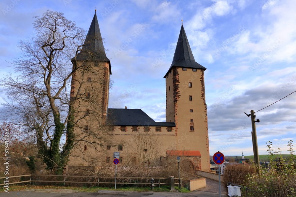 Towers of the medieval castle in Rochlitz/Saxony/Germany/Europe with blue sky and white clouds