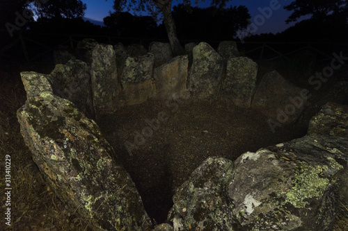 Landscape at dusk with ancient prehistoric dolmen. Gran Dolmen in Montehermoso. Extremadura Spain. photo