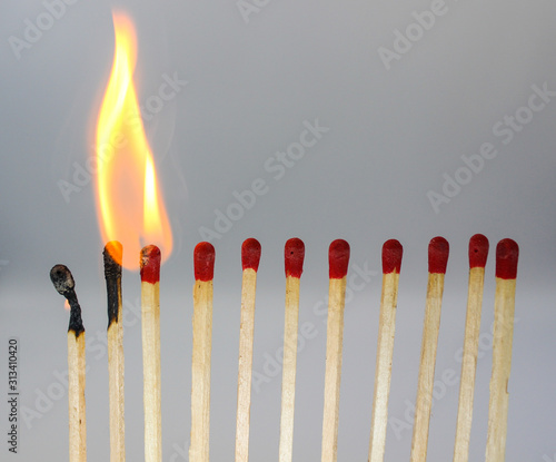 burning match on black background