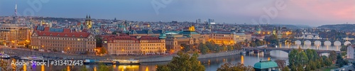 Prague - The panorama of the city with the bridges at dusk.